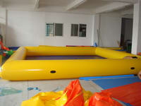 Yellow Inflatable Pool with dark blue bottom